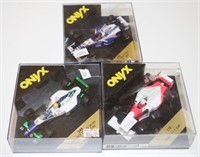 Three Onyx model racing cars