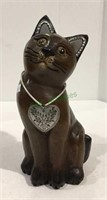 Carved wooden cat with metal accent heart