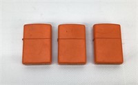 3 Unused Orange Zippo lighters