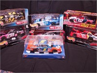 Seven 1/24 scale NASCAR cars in original boxes