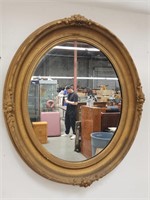 Vintage oval gilt-framed mirror