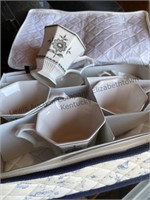 Six cups in fabric storage case, 6 saucers to