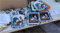 10 or more decorative potholders, dish rags,
