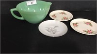 Lot of beautiful serving and kitchen decor.