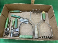 Box of kitchen utensils with vintage green wooden