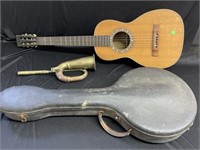 Guitar, Old Banjo Case and Brass Instrument