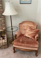 Brass lamp table and velvet armchair