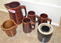 Group of brown glazed stoneware. Height of tallest