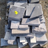 Grey paver bricks of various sizes