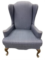 Blue upholstered wing back chair