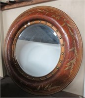 Beveled glass round wall mirror that measures