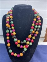 Long single strand bead necklace