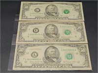 Three $50 Bills