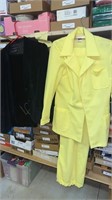 Woman’s pant suits yellow is size 15/16 and black