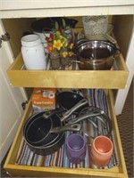 Cookware and utensils in cabinets