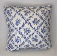 Blue and white throw pillow