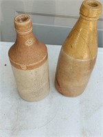 2 antique crock beer bottles 1 has crack signed