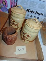 cannisters and wooden mug