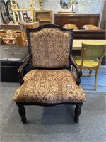 Tan upholstered armchair