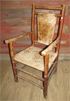 Antique Hickory arm chair. Note: Has fading.