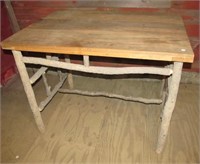 Plank top table with hickory legs. Measures 39" x