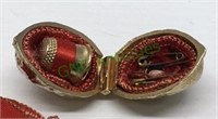 Vintage locket style walnut sewing kit includes