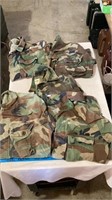 Various Army shirts unknown size.