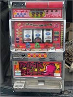 Vintage pink bell slot machine