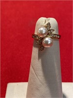 Pearl and white CZ ring. Size 4. No marks found.