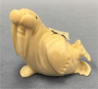 2 1/4" tall core ivory carving of a walrus, ivory