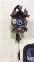 Black Forest cuckoo clock with pinecone weights,