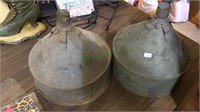 Two vintage galvanized steel funnels, one with a