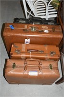 (4) Suitcases (3) Brown & (1) Black