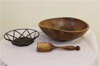 Lg. wooden pestle & mortar on wrought iron