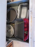 Bakeware under Stove and in Cabinet #89