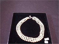 Jackie Kennedy three-strand pearl necklace from