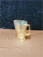 Peach colored glass pitcher approx 11 inches tall