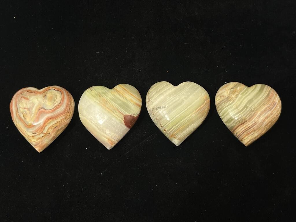 4 carved stone hearts.