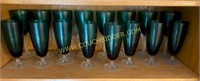green goblets and wine glasses