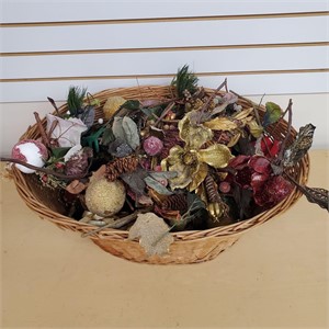 Basket of artificial sugared fruit and foliage