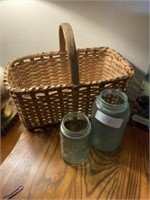 Two old blue canning jars and basket small one