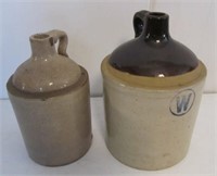 (2) Crock jugs. Measures 10" tall and 11" tall