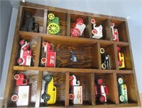 Wood display case filled with die cast banks and