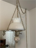 HANGING LAMP WITH DECOR ITEMS ON DRESSER