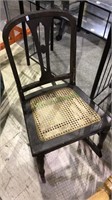 Small antique child's rocking chair with new cane