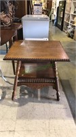 Victorian pressed Oak table, with a shelf below,