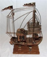 Vintage musical copper fishing boat.