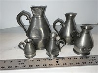 Five pewter pitchers