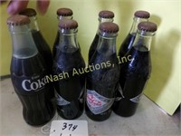 8 Coke bottles-some 75th anniversary