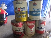 5 old oil cans